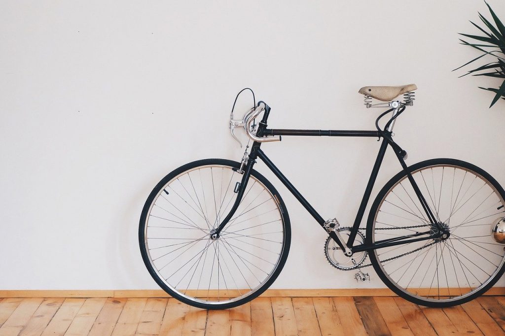 Bicycle against white wall